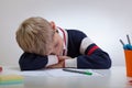 Schoolboy sleeping at the desk Royalty Free Stock Photo