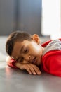 Schoolboy sleeping with mouth open at desk in a classroom Royalty Free Stock Photo