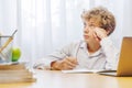 Schoolboy studying at home, doing homework Royalty Free Stock Photo
