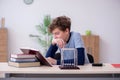 Schoolboy studying physics at home Royalty Free Stock Photo