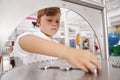 Schoolboy taking part in a science test at a science centre Royalty Free Stock Photo