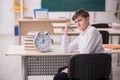 Male pupil in time management concept Royalty Free Stock Photo