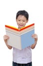 Schoolboy in uniform reading book Royalty Free Stock Photo
