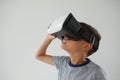 Schoolboy using virtual reality headset Royalty Free Stock Photo