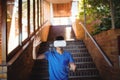 Schoolboy using virtual reality headset on staircase Royalty Free Stock Photo