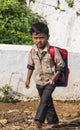 Schoolboy walks to his school in Kallatti, Nilgiri Hills, India.