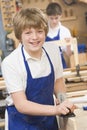 Schoolboy in woodwork class Royalty Free Stock Photo
