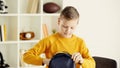 schoolboy in yellow jumper holding backpack Royalty Free Stock Photo