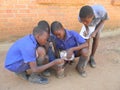 Schoolboys conducting experiment with home-made equipment.