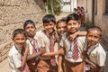 Schoolboys playing in round of friends with smily faces in India Royalty Free Stock Photo