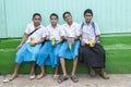 Schoolboys in Tonga. Friendly boys in wraparound skirts eating chips after school.