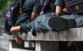 Schoolboys wear military students uniform sleeping on a bench made of cement Royalty Free Stock Photo