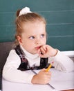 Schoolchild in classroom near blackboard. Royalty Free Stock Photo