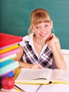 Schoolchild in classroom near blackboard. Royalty Free Stock Photo