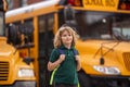 Schoolchild getting on the school bus. American School. Back to school. Kid of primary school. Happy children ready to Royalty Free Stock Photo