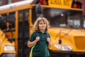 Schoolchild getting on the school bus. American School. Back to school. Kid of primary school. Happy children ready to Royalty Free Stock Photo