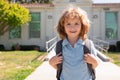 Schoolchild running on playground end of class. School vocation.