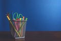 Schoolchild and student studies accessories. Back to school concept. Pencils and felt pens on blue backgroung Royalty Free Stock Photo