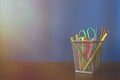 Schoolchild and student studies accessories. Back to school concept. Pencils and felt pens on blue backgroung. Toned Royalty Free Stock Photo