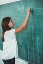 Schoolchild writing on blackboard Royalty Free Stock Photo