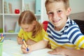 Schoolchildren are came back to school and learning at the table in classroom Royalty Free Stock Photo