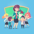 Schoolchildren give flowers to the happy teacher in classroom. Teacher`s Day. Back to school. Royalty Free Stock Photo