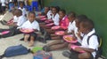 Schoolchildren having lunch at a school in South Africa i Royalty Free Stock Photo