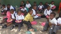 Schoolchildren having lunch at a school in South Africa i Royalty Free Stock Photo