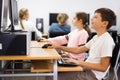 Schoolchildren preparing for lessons on the computer