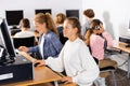 Schoolchildren preparing for lessons on the computer