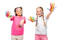 schoolchildren showing painted colorful hands and looking at camera Royalty Free Stock Photo