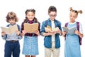 schoolchildren standing and reading books Royalty Free Stock Photo