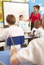 Schoolchildren Studying In Classroom With Teacher Royalty Free Stock Photo