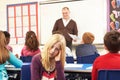 Schoolchildren Studying In Classroom With Teacher Royalty Free Stock Photo