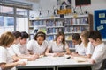 Schoolchildren studying in school library Royalty Free Stock Photo