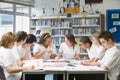 Schoolchildren studying in school library Royalty Free Stock Photo