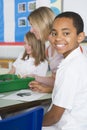 Schoolchildren and their teacher in an art class Royalty Free Stock Photo