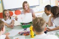 Schoolchildren and their teacher in an art class Royalty Free Stock Photo