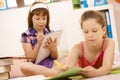 Schoolchildren writing into booklet