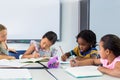 Schoolchildren writing on books Royalty Free Stock Photo