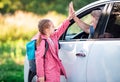 Schooler giving five to father in car Royalty Free Stock Photo