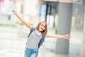 Schoolgirl with bag, backpack. Portrait of modern happy teen sch Royalty Free Stock Photo