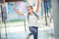 Schoolgirl with bag, backpack. Portrait of modern happy teen school girl with bag backpack. Girl with dental braces and glasses Royalty Free Stock Photo