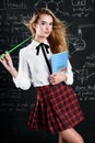 Schoolgirl by blackboard
