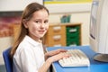 Schoolgirl In IT Class Using Computer