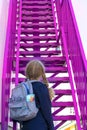 Schoolgirl climbs the stairs