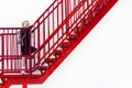 Schoolgirl climbs the stairs. stage, career ladder. girl in a uniform with a backpack.