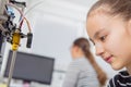 Schoolgirl with 3d printe. education, technology. Royalty Free Stock Photo