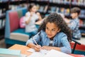 african american schoolgirl doing homework Royalty Free Stock Photo