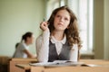 Schoolgirl eager to answer a question